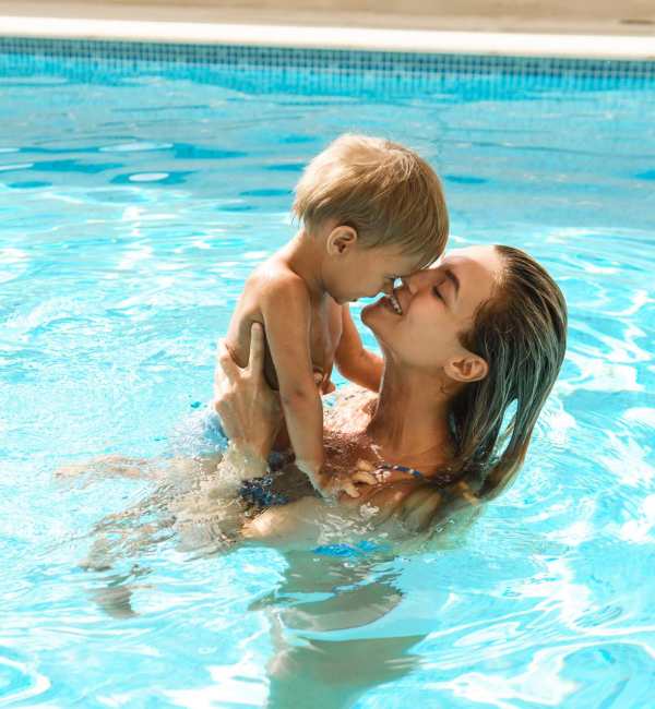 Resident with her child in the pool at McCue Galleria in Houston, Texas