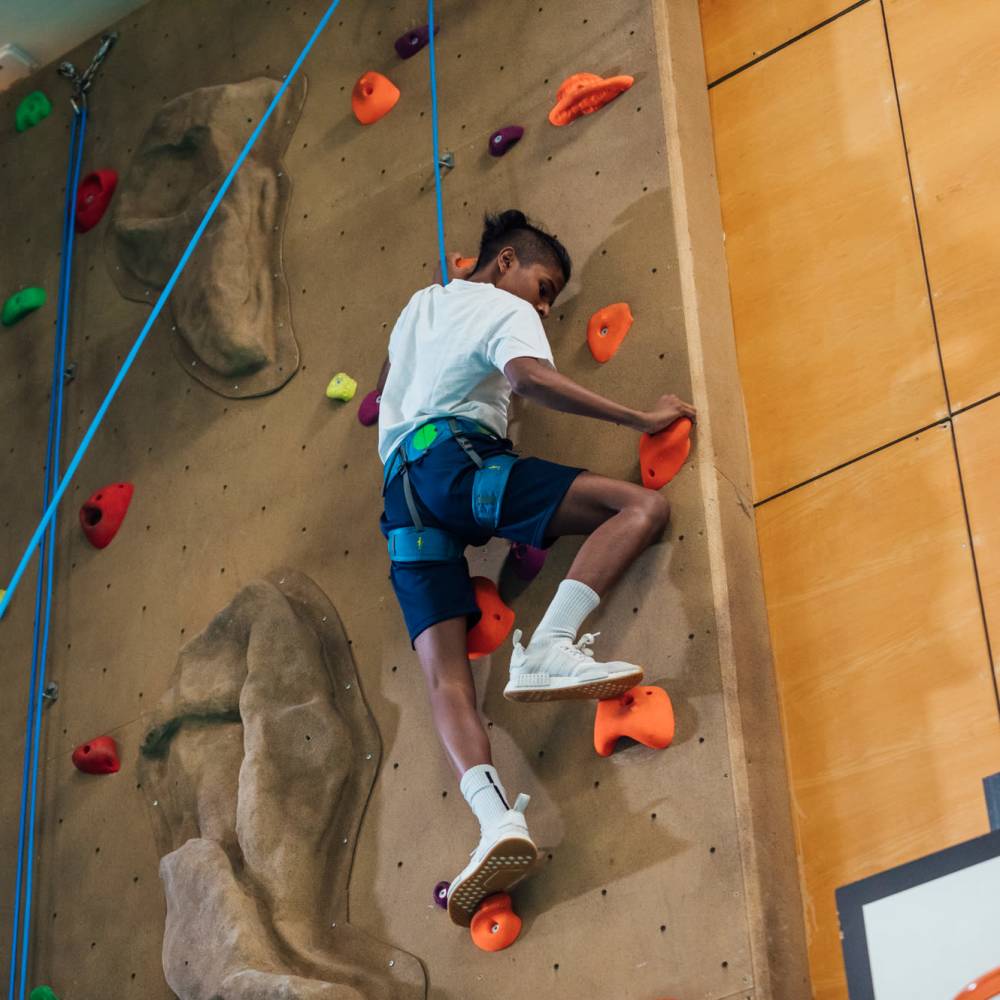 Resident rock climbing near Art on Highland in Phoenix, Arizona