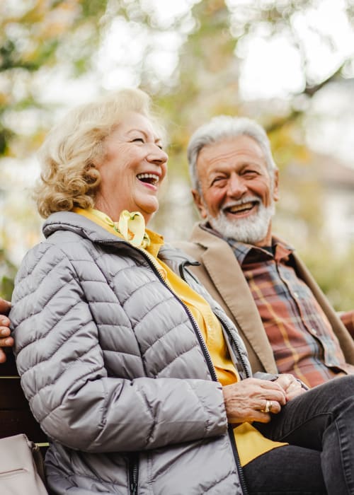 Two residents sitting outside together at Champion Estates Assisted Living in Warren, Ohio