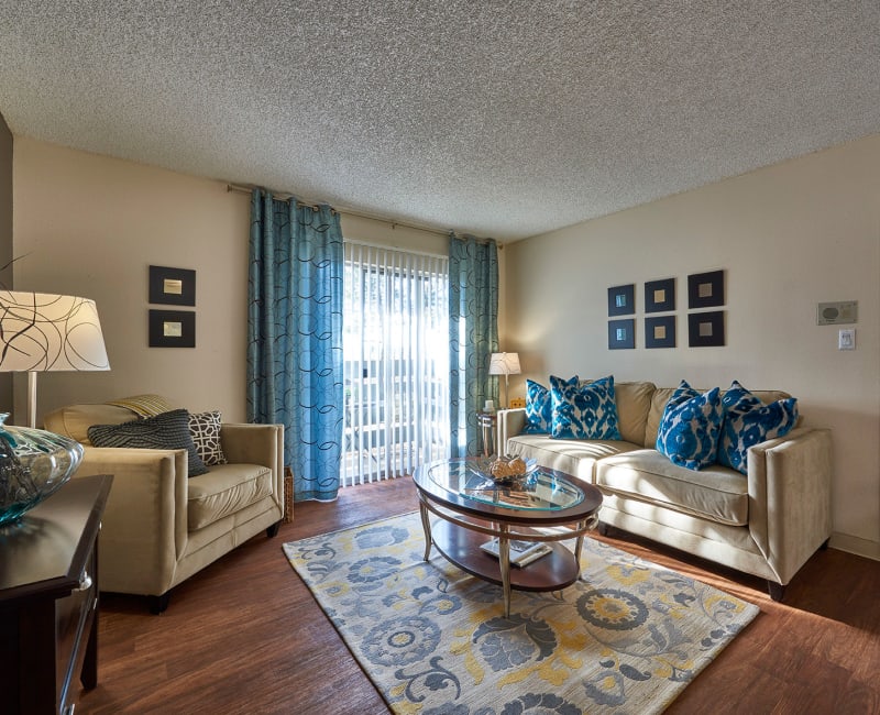 Comfortably decorated living area in a model home at Hampden Heights Apartments in Denver, Colorado