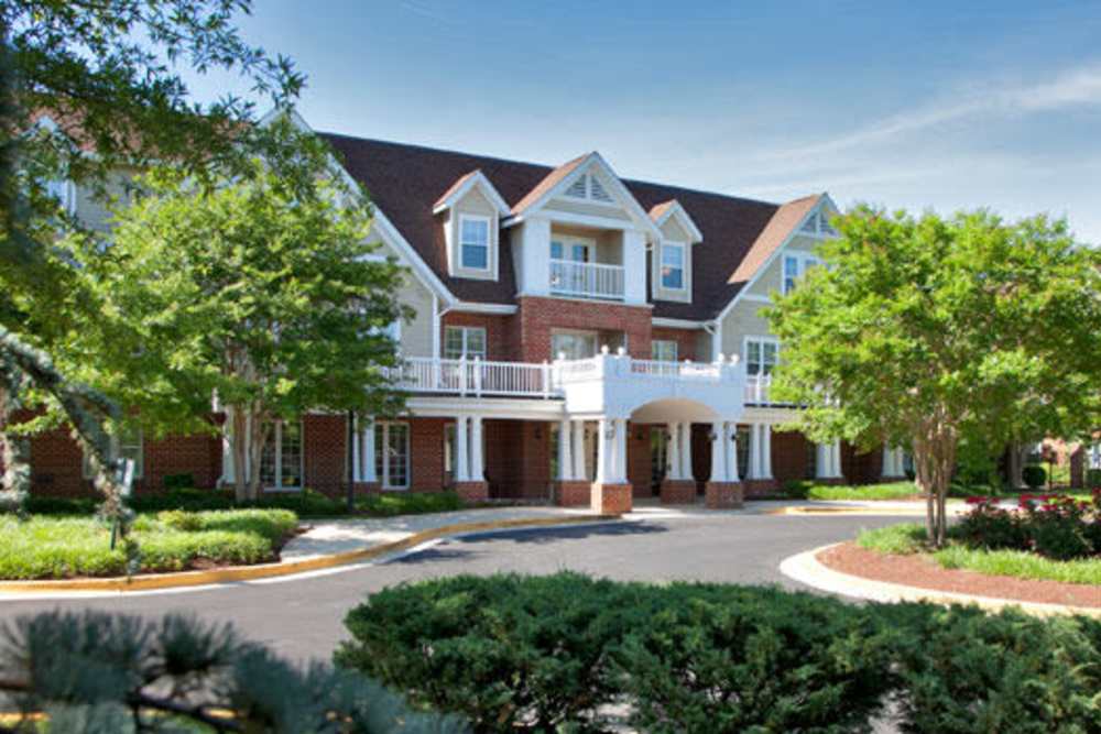 Building exterior with welcoming entrance at The Willows Senior Community in Bowie, Maryland