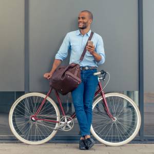 Resident biking home from the office at Greer Mill Residences in Greer, South Carolina