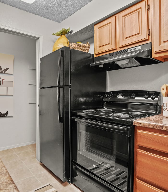 Kitchen with granite countertops at Sunchase Apartments in Tulsa, Oklahoma