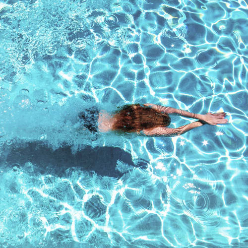 A woman diving in the pool at Vesta Creeks Run in North Charleston, South Carolina