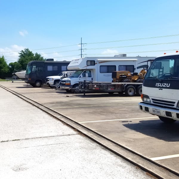 Outdoor RV, boat, and auto parking spaces at StorQuest Self Storage in Tampa, Florida