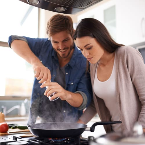 Residents cooking in a home at Fairway Heights in Twentynine Palms, California