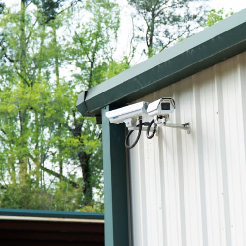 Security cameras mounted on an outside storage unit at Red Dot Storage in Glenwood, Illinois
