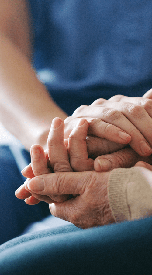 Resident and caregiver holding holds at Pillars Senior Living in Lakeville, Minnesota