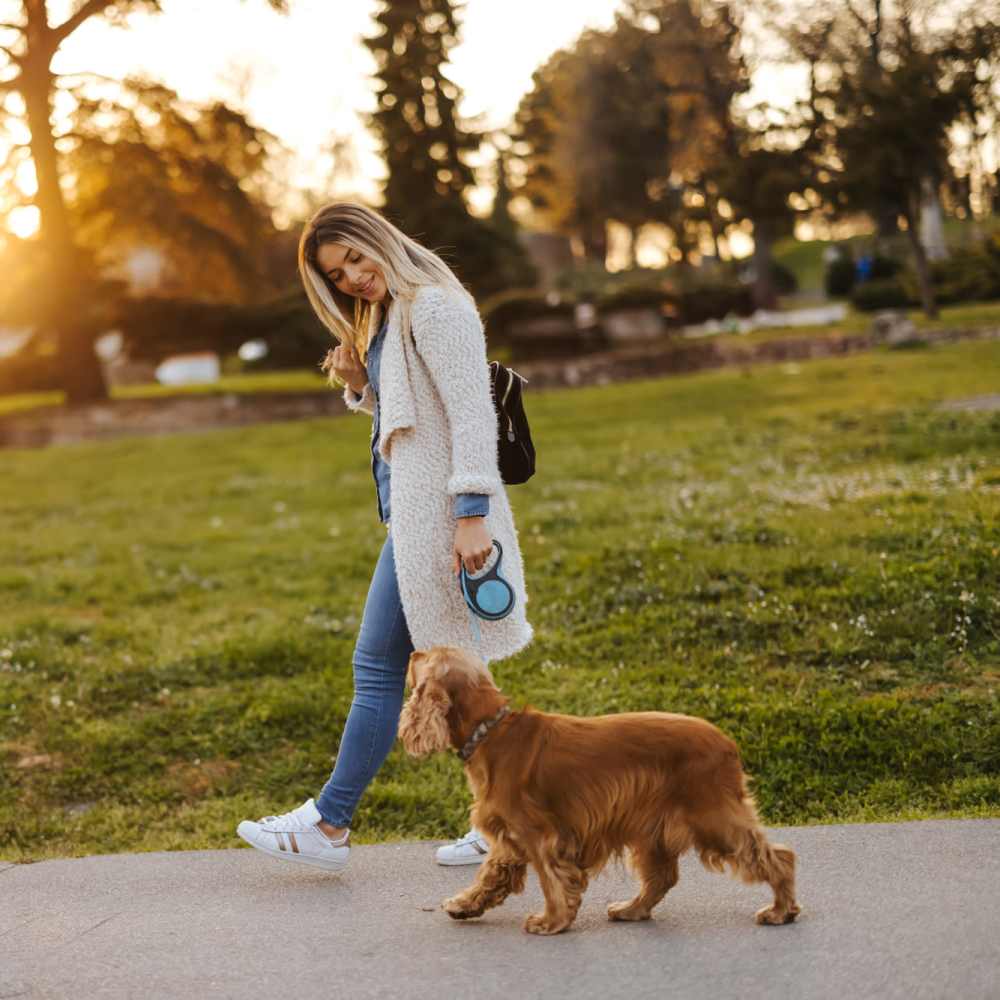Women walking her dog at Park Manor in Lebanon, Oregon