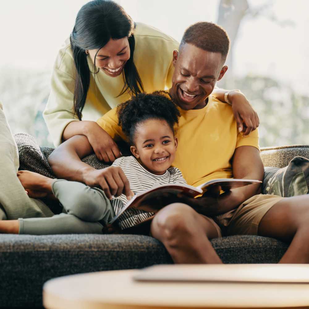 A lovely kid enjoying her story time with her parents at Park Manor in Lebanon, Oregon