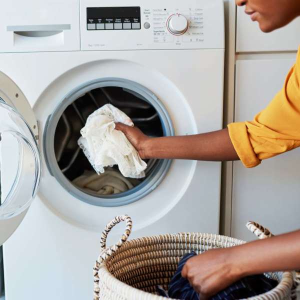 An apartment laundry room with washer and dryer at Pine Cove Apartments in Oregon, Wisconsin