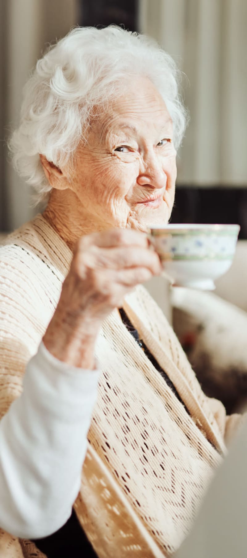 Resident enjoying some tea at Transitions At Home - Central in Stevens Point, Wisconsin