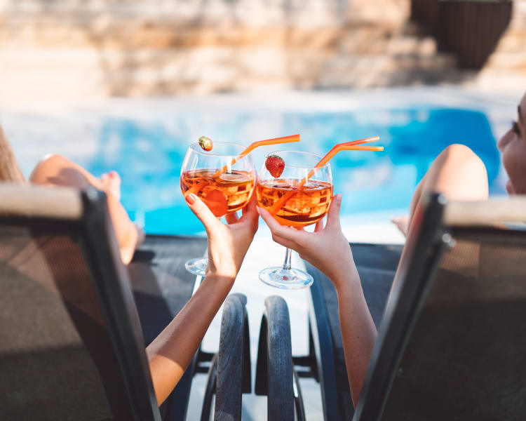 Residents enjoying a drink by the pool at Siena Apartments in Plantation, Florida