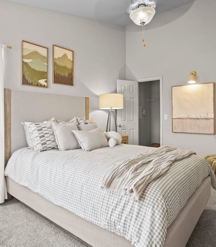 Chic bedroom with ceiling fan at Villas at Stonebridge in Edmond, Oklahoma