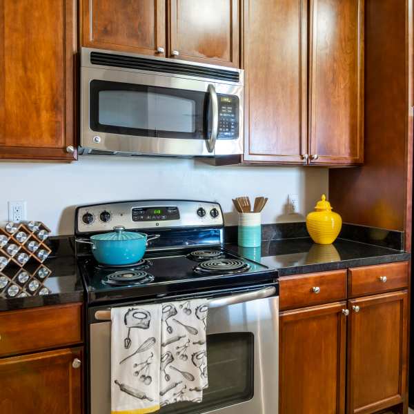 Mitchen with stainless-steel appliances and granite counter tops at The Carlton at Greenbrier, Chesapeake, Virginia