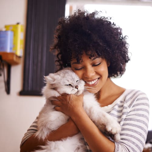 A resident holding her cat at Bard Estates in Port Hueneme, California