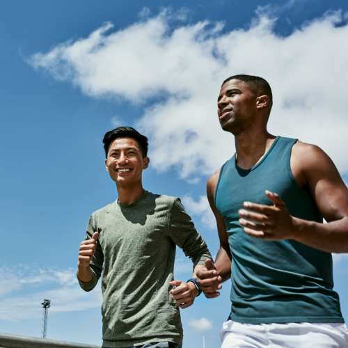 Friends running on a sunny day near West Park Townhomes in Augusta, Georgia