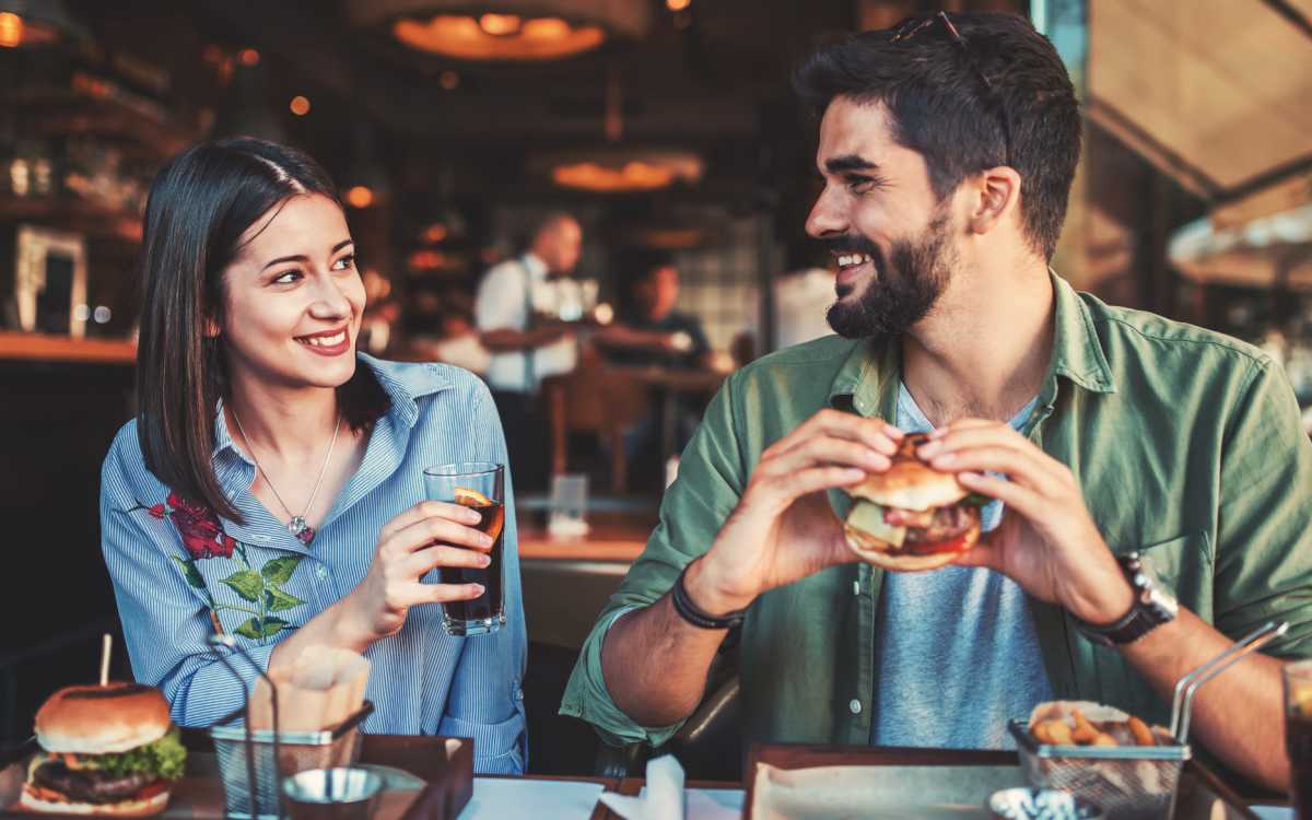 Residents couple having food in neighborhood restaurant at Amelia Apartments in Fayetteville, North Carolina
