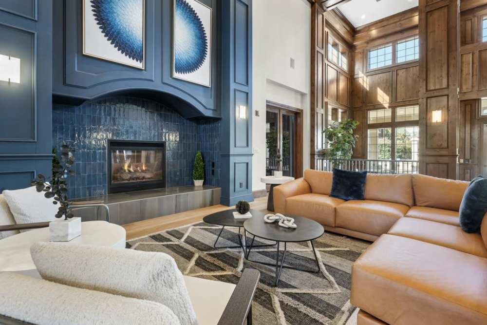 Interior view of the resident clubhouse with a cozy seating area at Veridian at South Meadows in Reno, Nevada