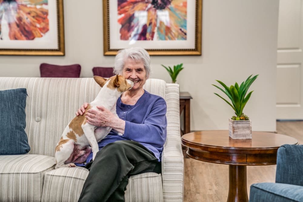 senior resident with small dog