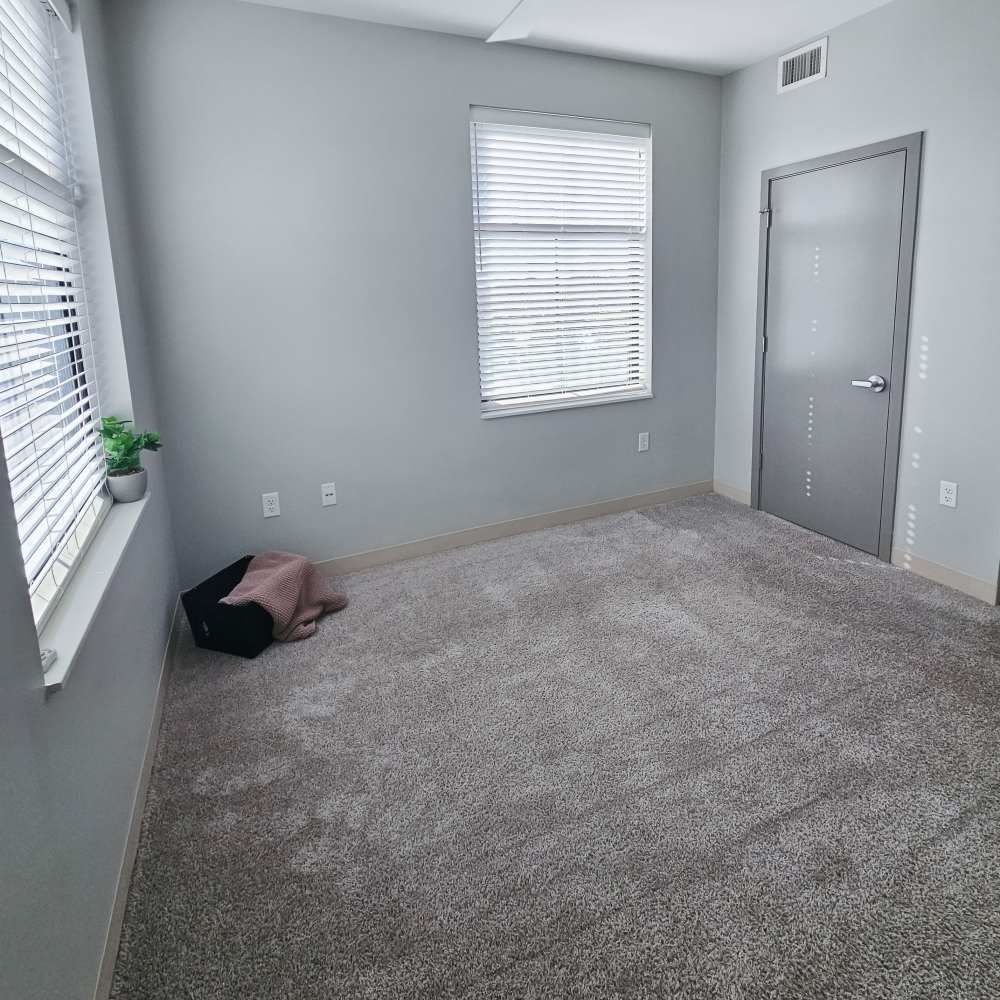 Spacious bedroom with ceiling fan at Leo and Alpine in Grand Rapids, Michigan