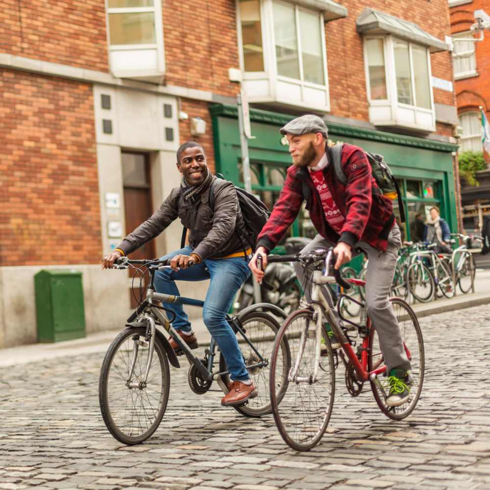Resident friends riding a bike near The Simone in Silver Spring, Maryland