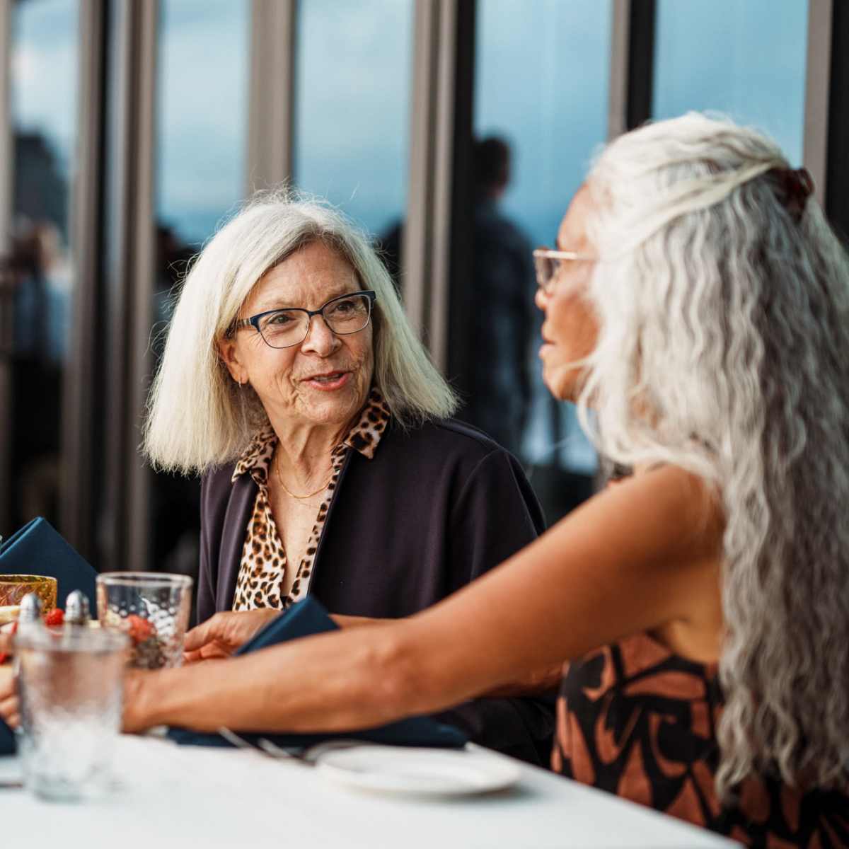 Team members having a meeting in a glass office at Heirloom by Ovation in Las Vegas, Nevada 