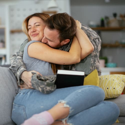 Residents hugging in a home at Eagleview in Joint Base Lewis McChord, Washington