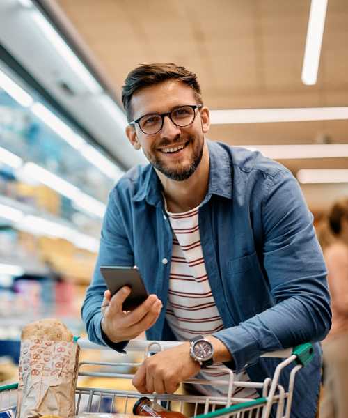 Man buying grocery nearby UTE Creek Apartments in Longmont, Colorado