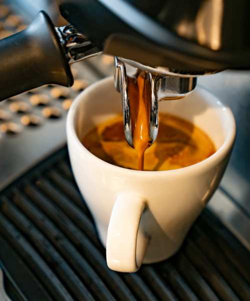Coffee pouring into a white cup at Richwood Greene Senior Living in Richwood, Ohio