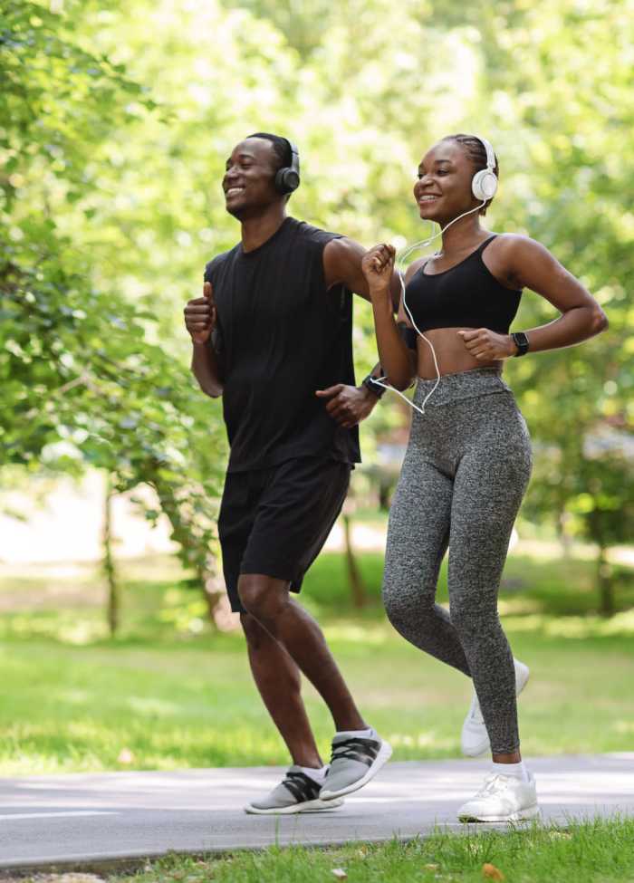 Residents running in park at The Landing at College Station in College Station, Texas