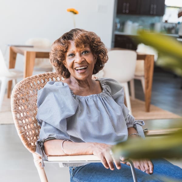 A resident smiling at Kenmore Senior Living in Kenmore, Washington.