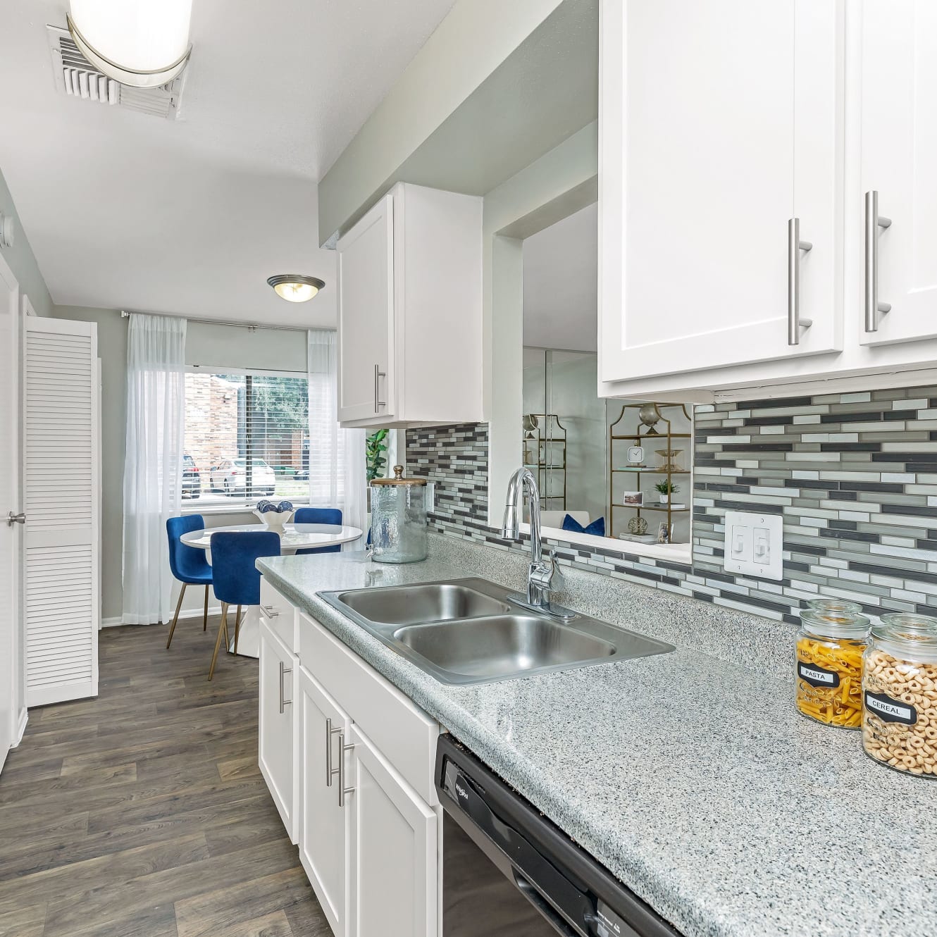 An expansive kitchen with a stainless-steel sink at Barringer Square in Webster, Texas