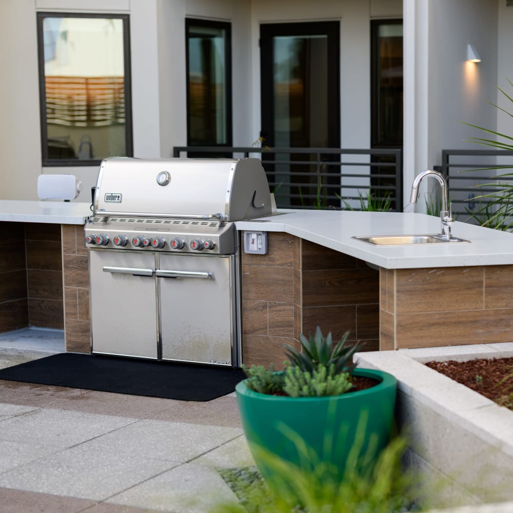 Outdoor barbecue grills and sink at  Artisan Crossing in Belmont, California