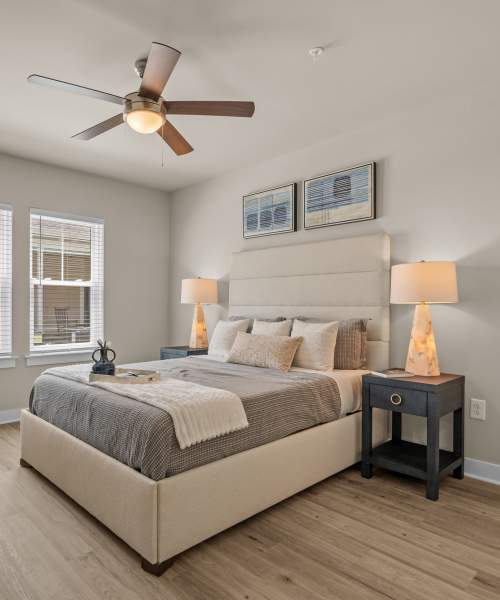 Bedroom with carpet flooring and ceiling fan at The Edison at Farrow Commons in North Myrtle Beach, South Carolina