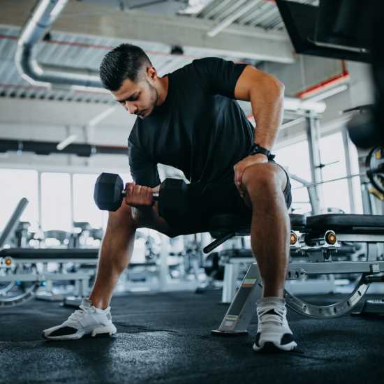 Resident in the community fitness center at The Depot at North Salem in Apex, North Carolina 