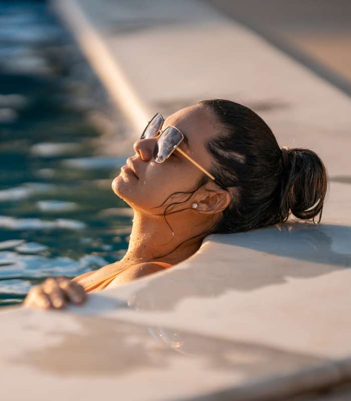 Resident enjoying in the pool at Edge at Concord in Concord, North Carolina