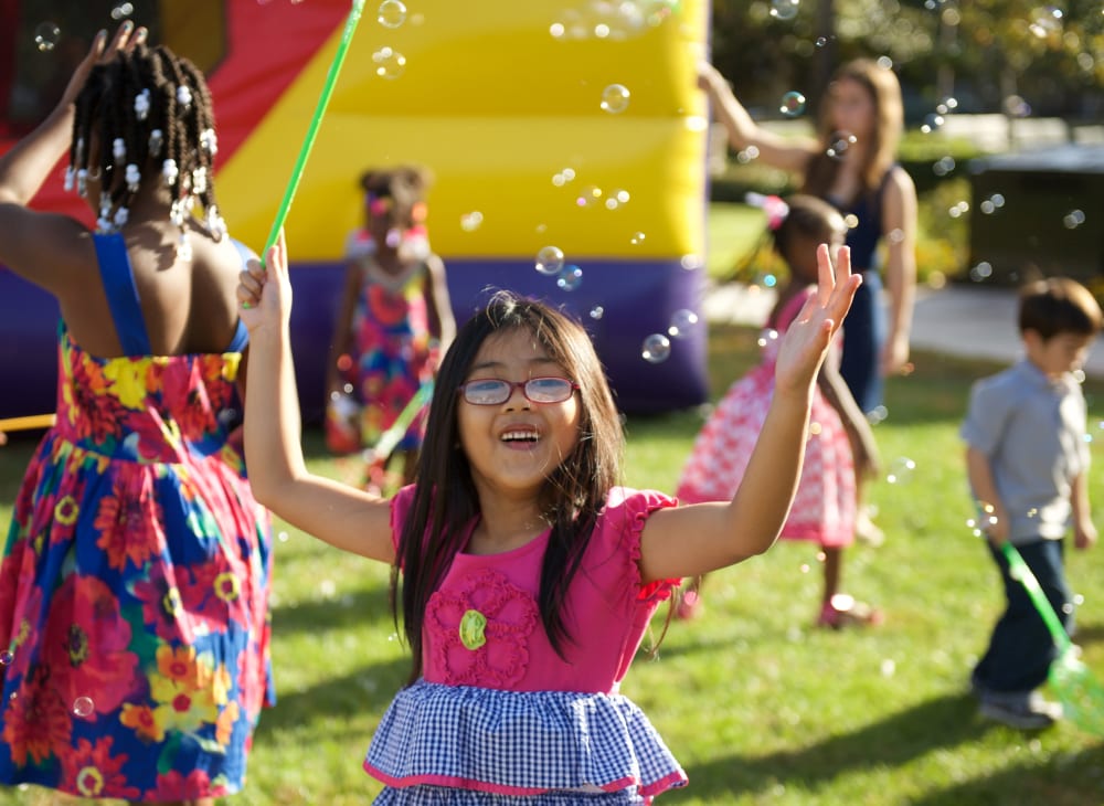 Children playing with bubbles during resident event at Blue Sky in Fallon, Nevada