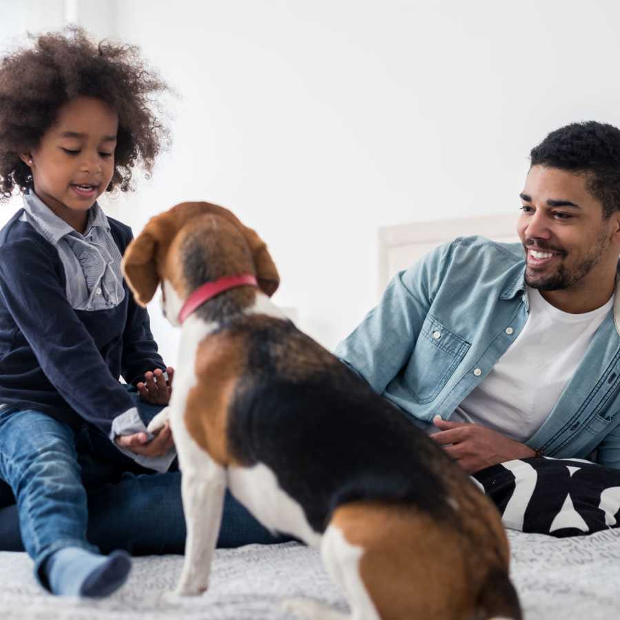 Residents relaxing with their beagle at Sterling Oaks in Norfolk, Virginia