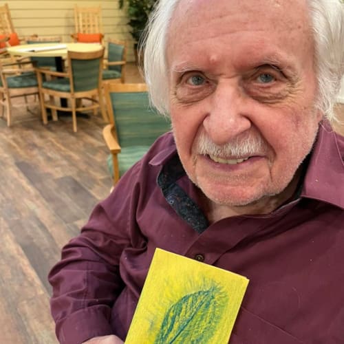 Resident smiling at Oxford Glen Memory Care at Carrollton in Carrollton, Texas