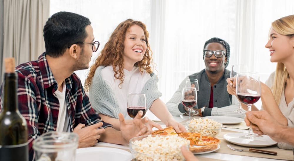 A group of friends having a meal together outside a restaurant near Mod Villas in Kingsland, Georgia  