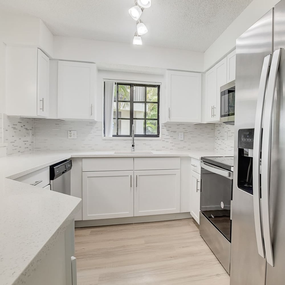 Kitchen with appliance at The Enclave at Delray Beach in Delray Beach, Florida