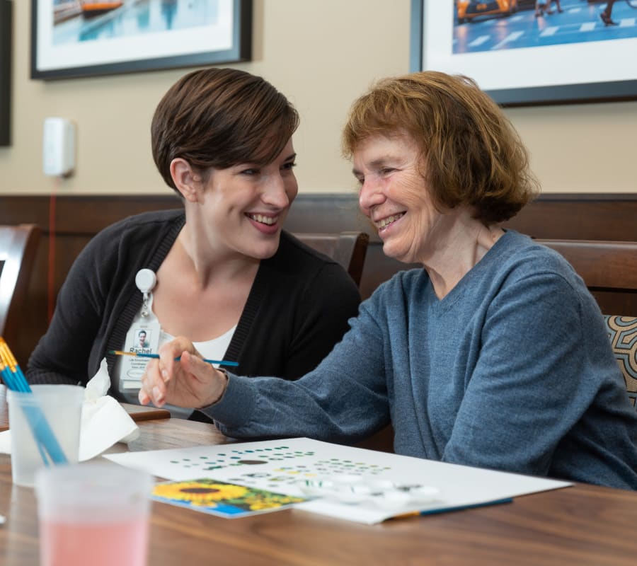 A resident painting at Touchmark on South Hill in Spokane, Washington