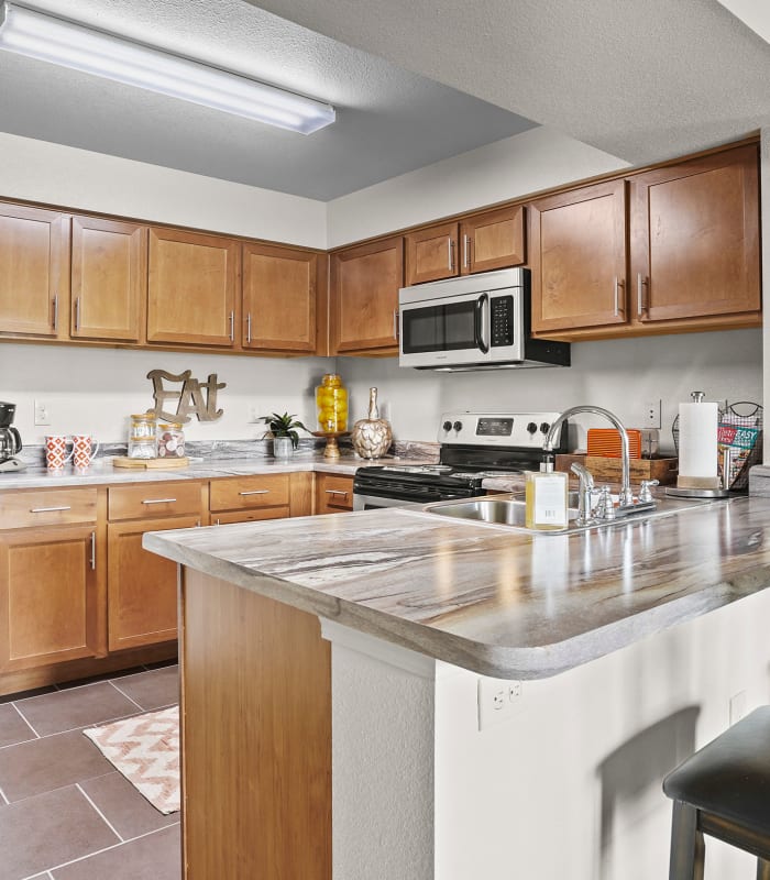 Kitchen with granite countertops at Portofino Apartments in Wichita, Kansas