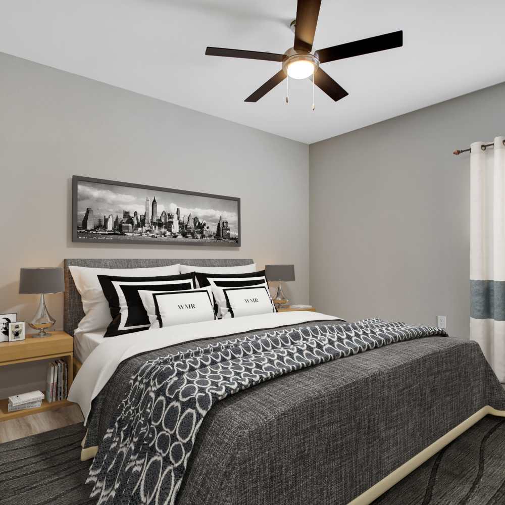 Primary bedroom with ceiling fan at Chenal Pointe at the Divide in Little Rock, Arkansas