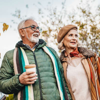 A resident couple taking a walk at Arbor Rose Senior Care in Mesa, Arizona