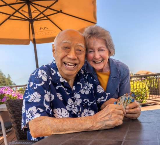 Resident couple poses for a picture at Merrill Gardens at Campbell in Campbell, California. 