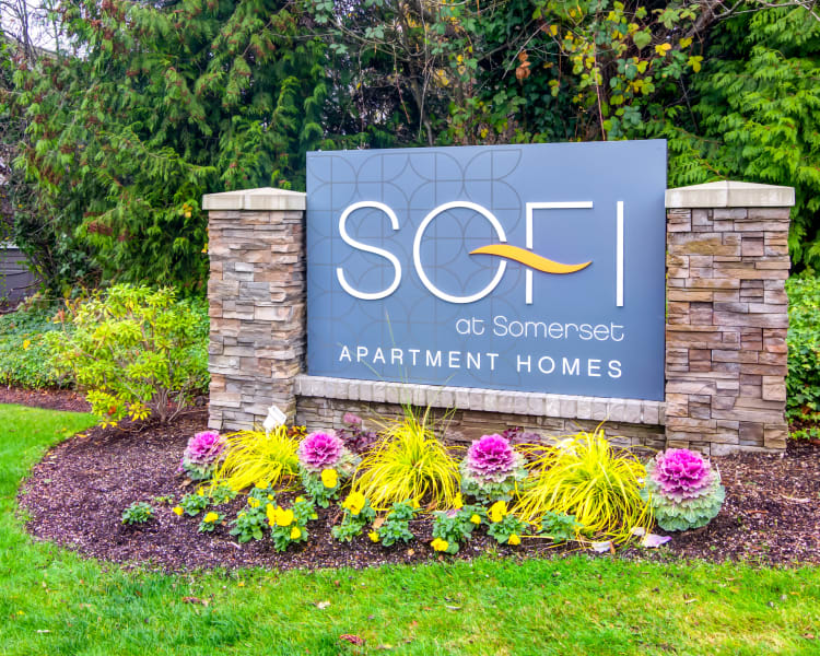 Our monument sign surrounded by flowers at Sofi at Somerset in Bellevue, Washington