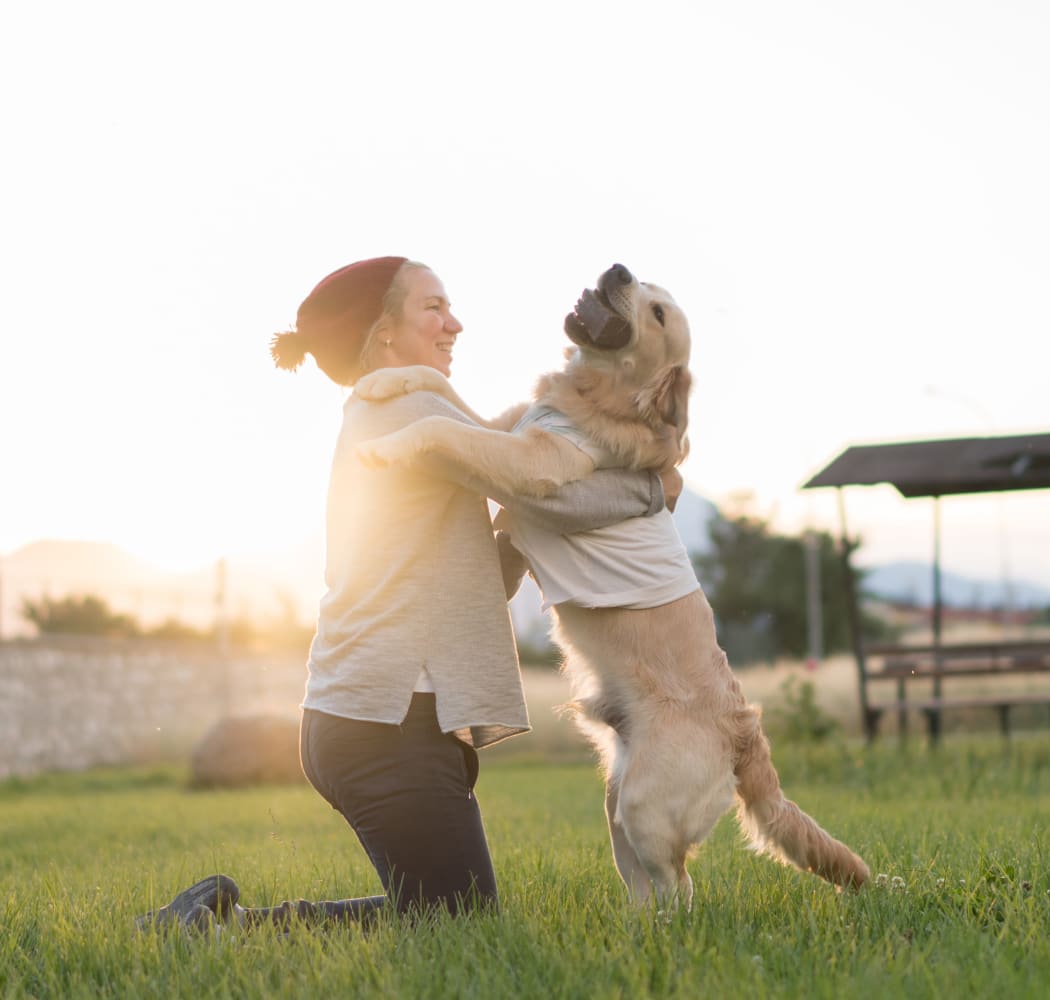 Woman and her happy pup at the park near Commonwealth at 31 in Spring Hill, Tennessee