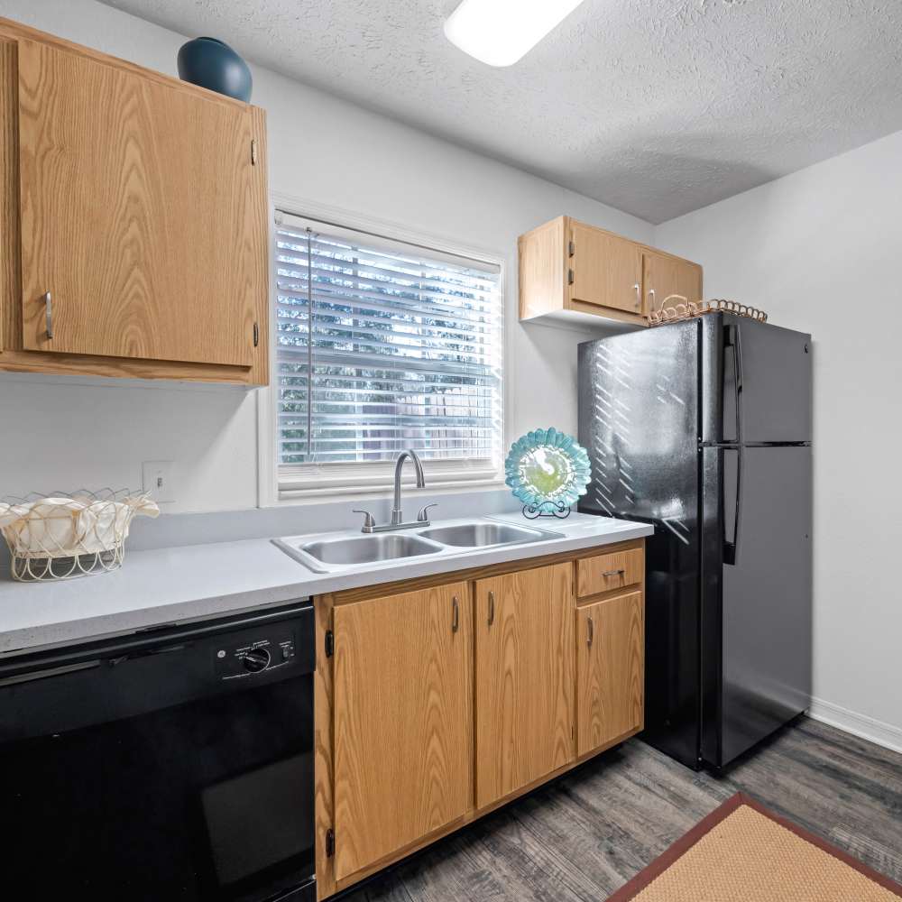 Modern kitchen with black appliances at Carlton Arms Of South Lakeland in Lakeland, Florida 